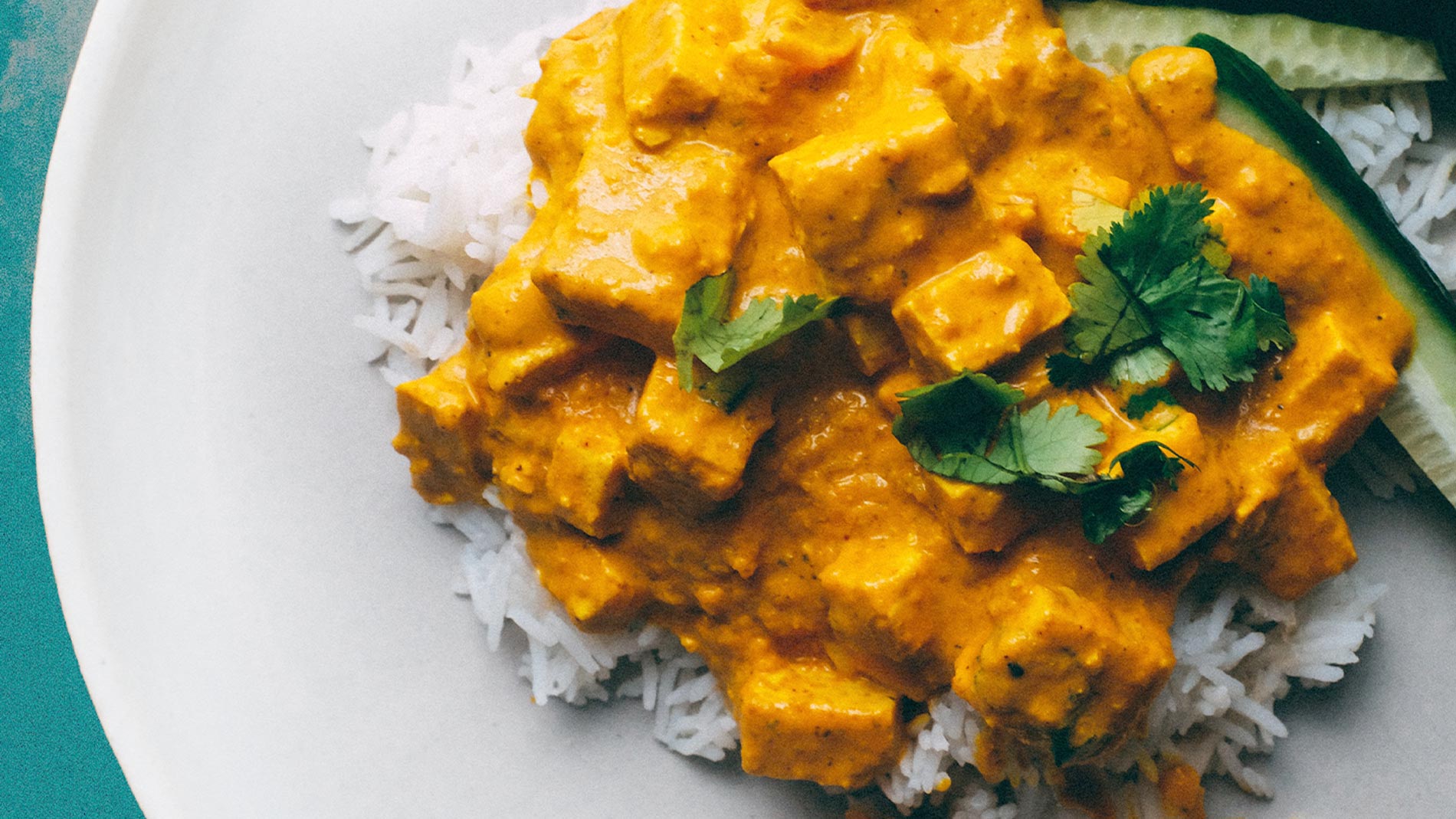 thick curry sauce with tofu on top of rice