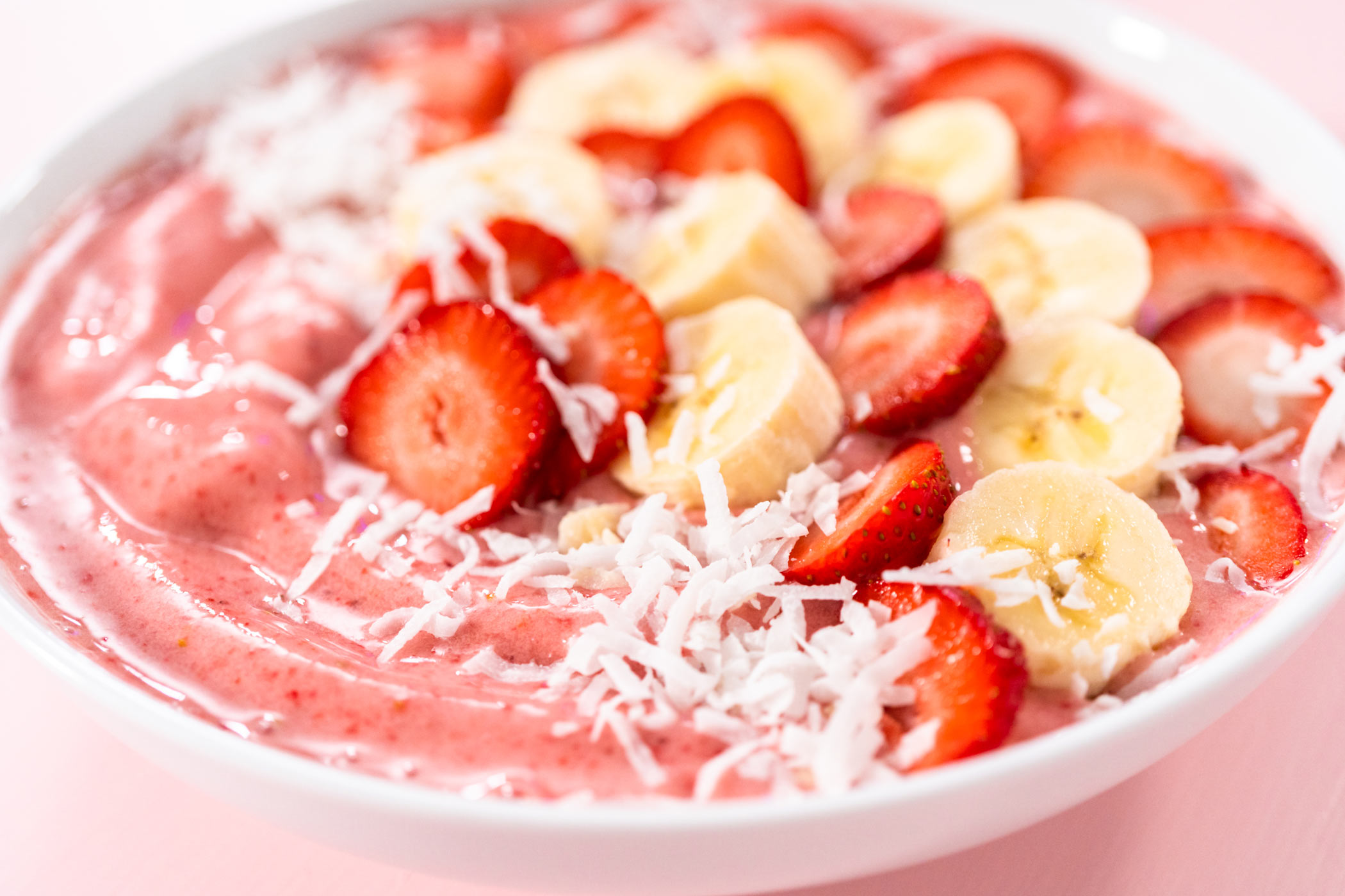 strawberry smoothie bowl with fresh fruits on top