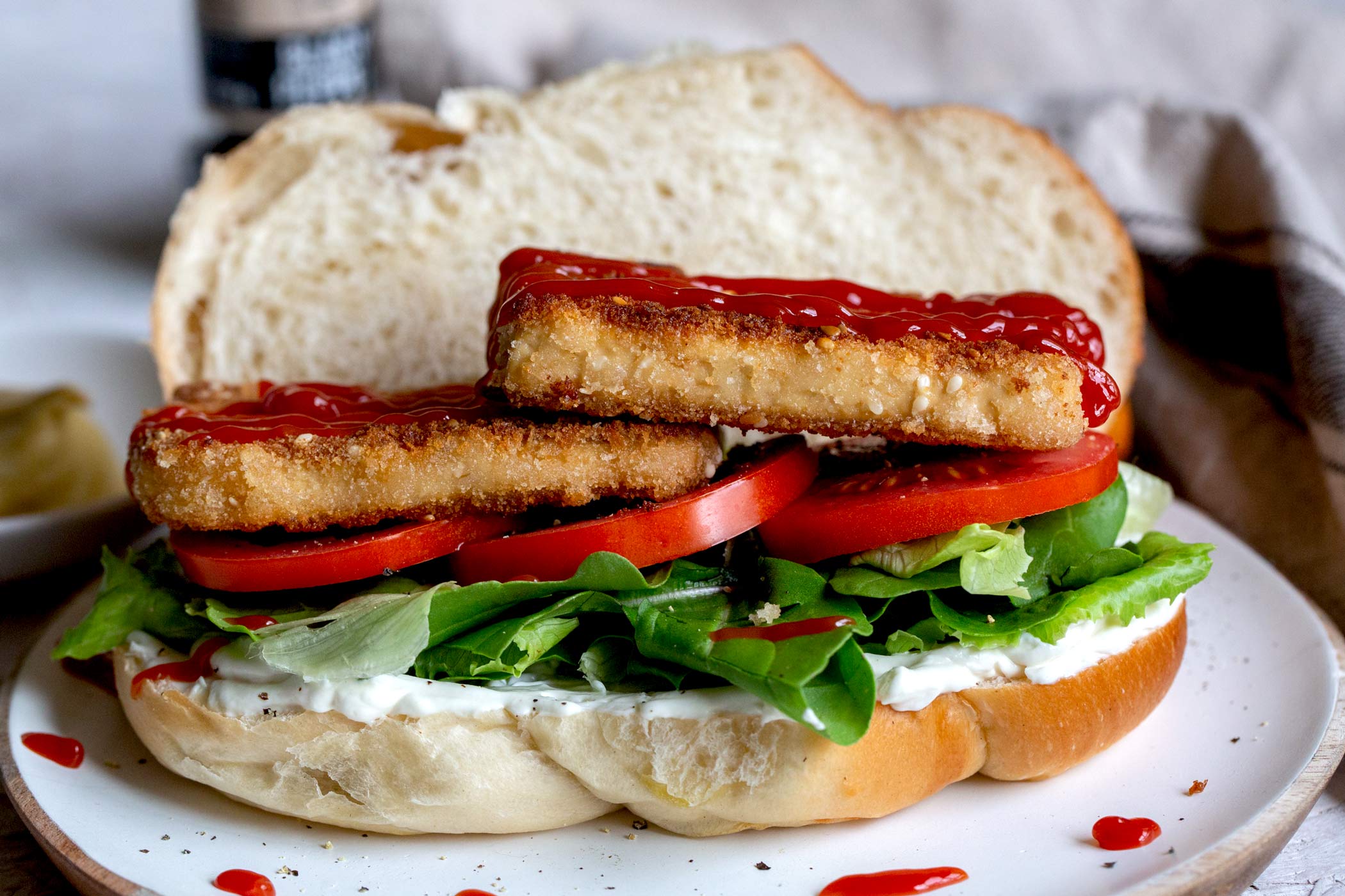 big sandwich with tofu schnitzels and fresh vegetables