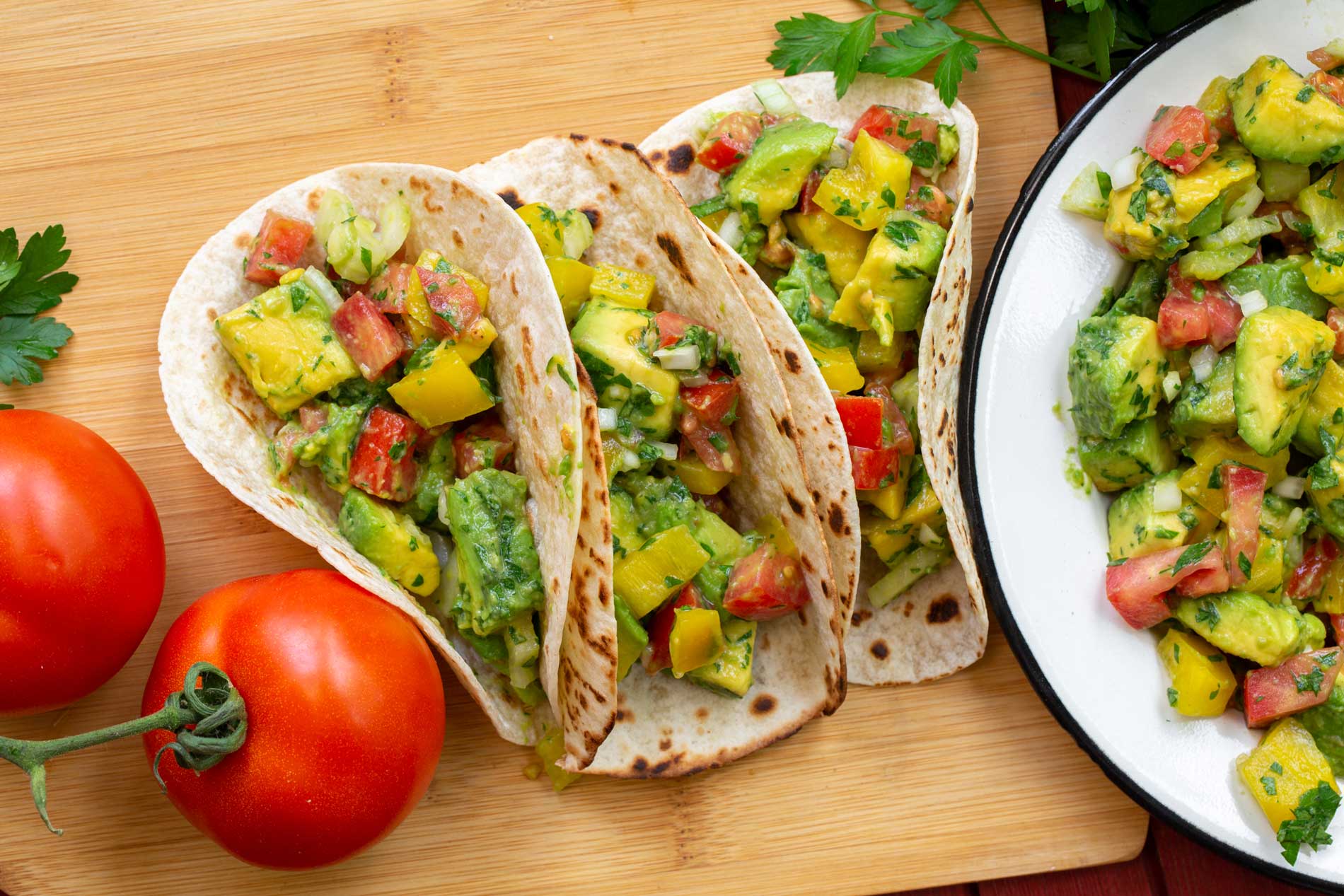 soft tacos with a filling of avocado and fresh vegetables