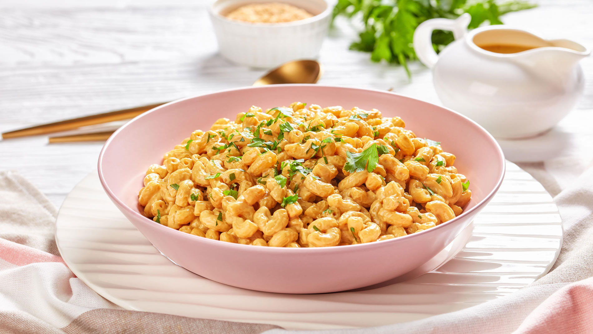 a bowl with vegan macaroni in a creamy cheese sauce