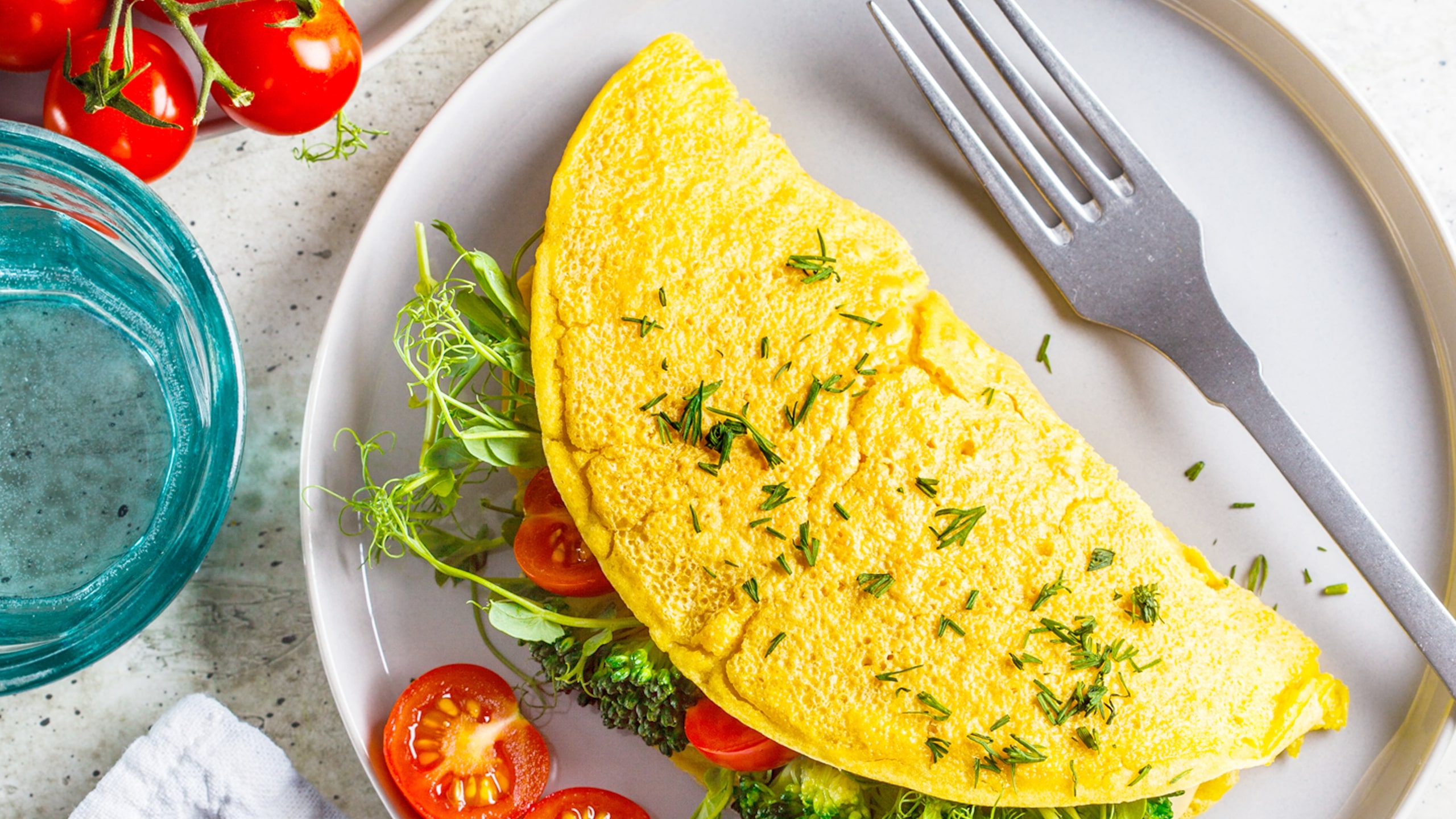 vegan omelet on a plated with fresh salad