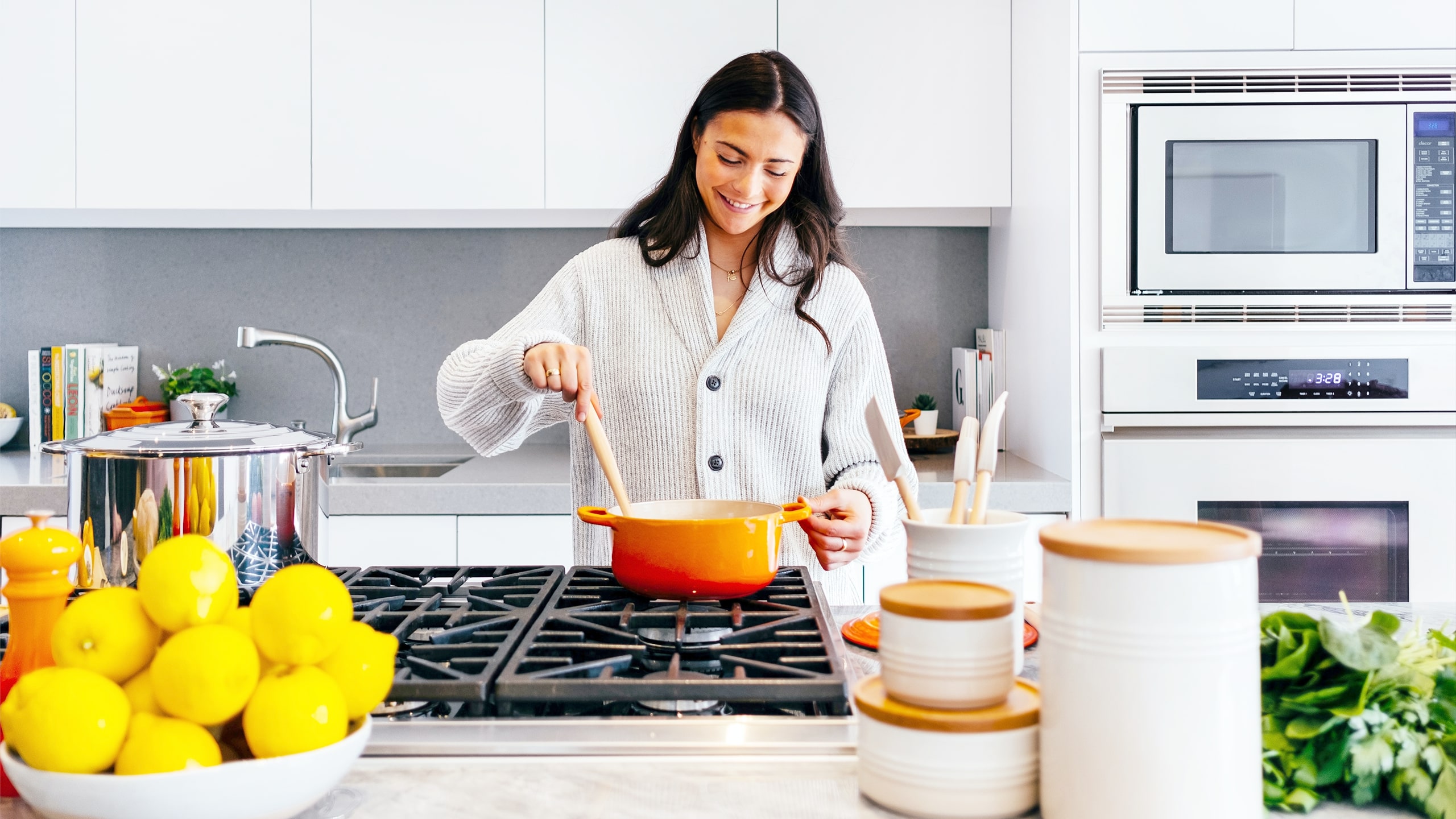 woman stirring a pot over the stove