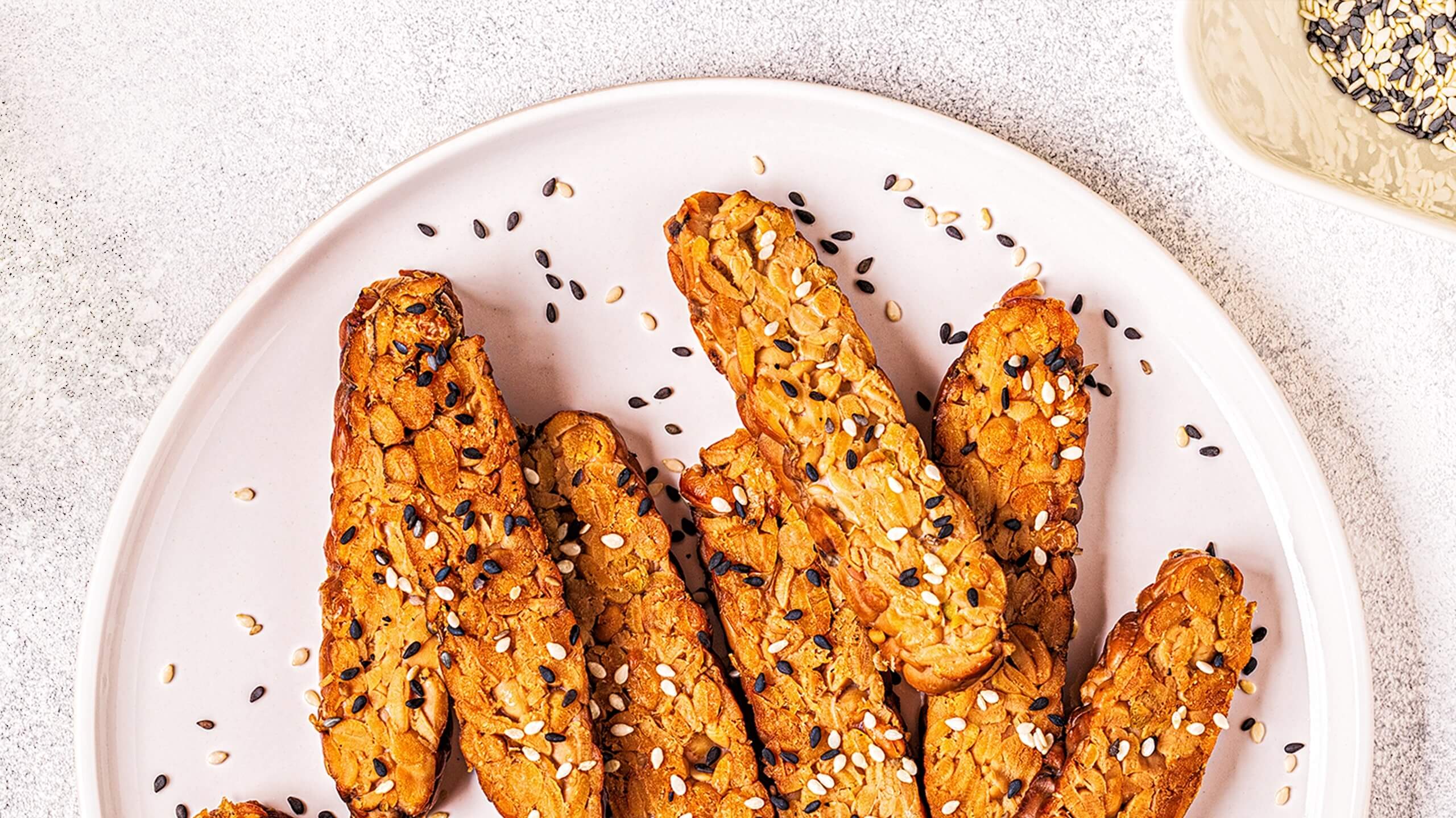 strips of cooked tempeh on a plate