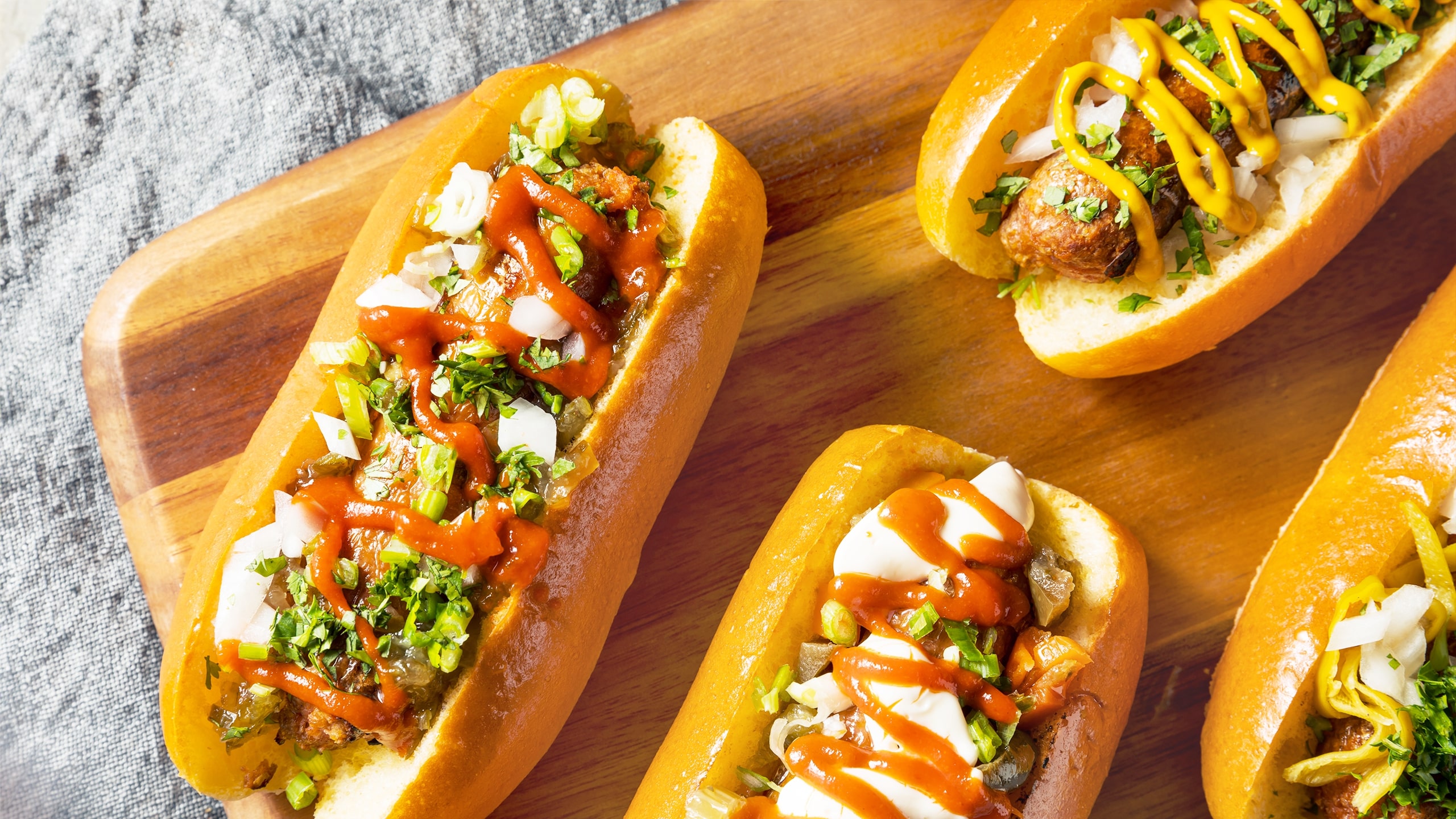 Vegan Hotdogs in buns with toppings