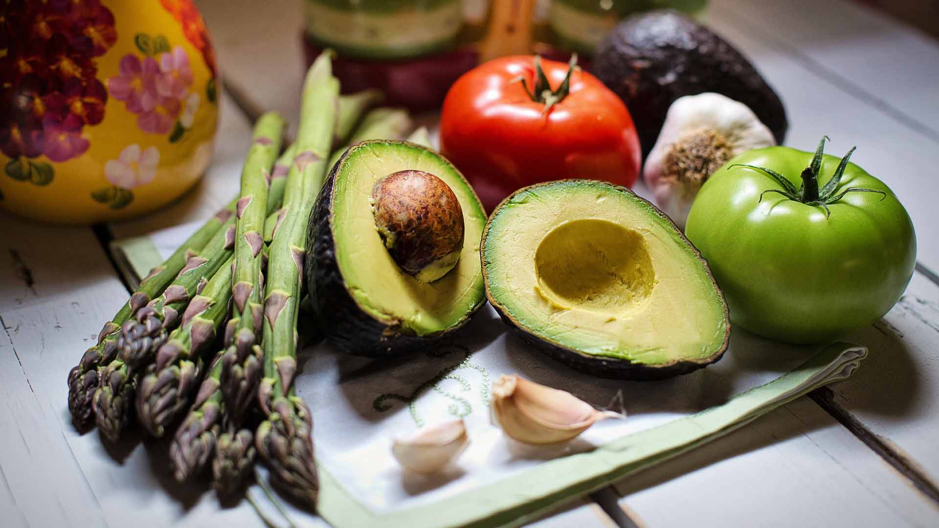 spread of tomatoes avocado and asparagus