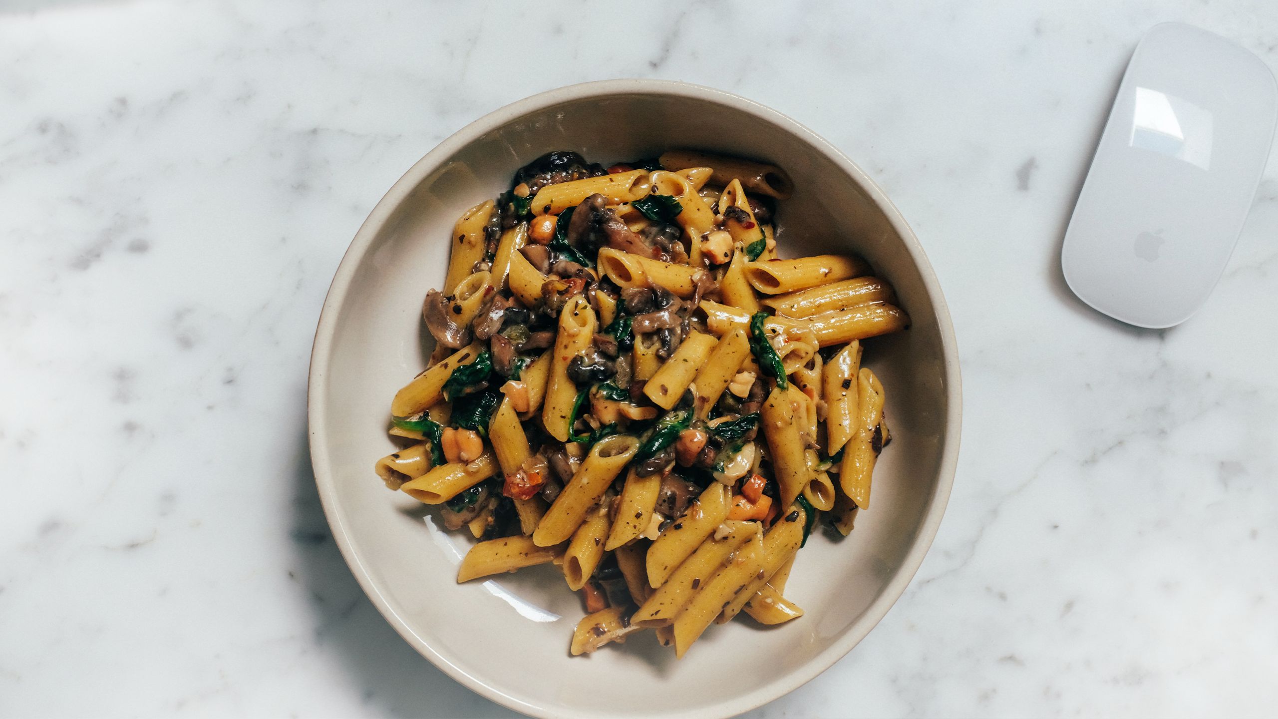 a bowl with creamy penne with mixed vegatables