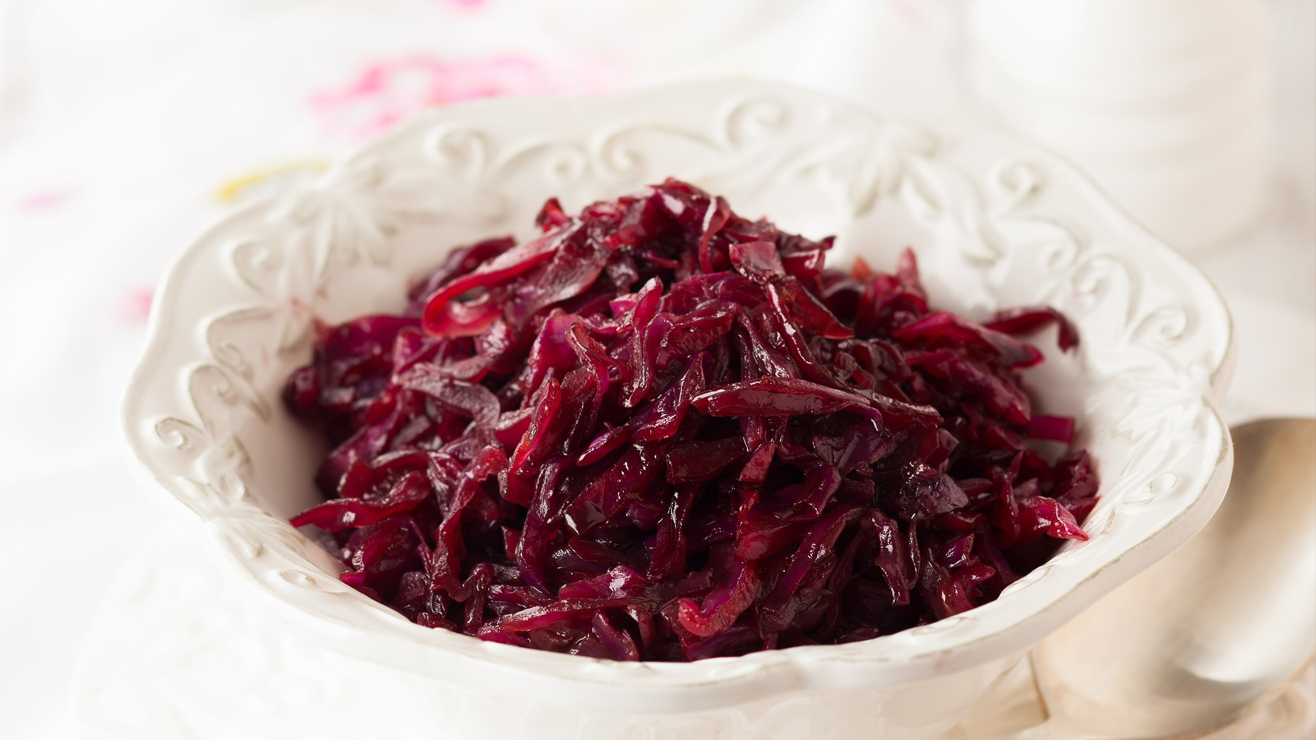 red cabbage shredded and cooked in a white bowl