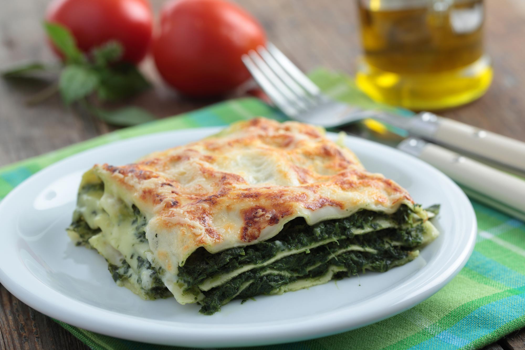 large slice of vegan spinach lasagna on a plate