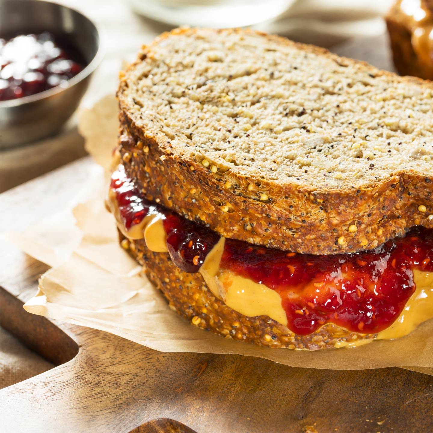 a sandwich of peanut butter and jelly with whole wheat bread