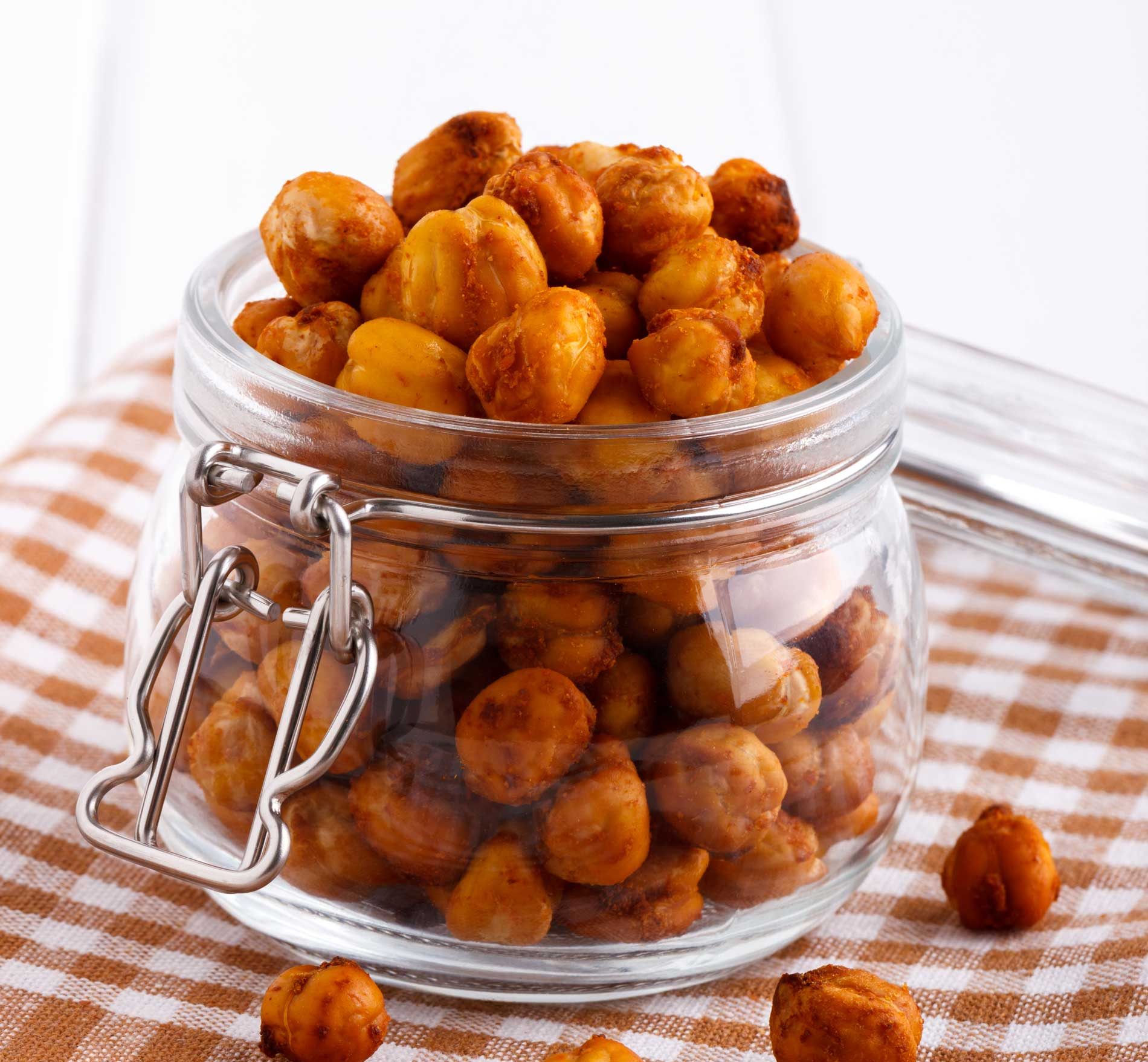 roasted and seasoned chickpeas in a glass jar