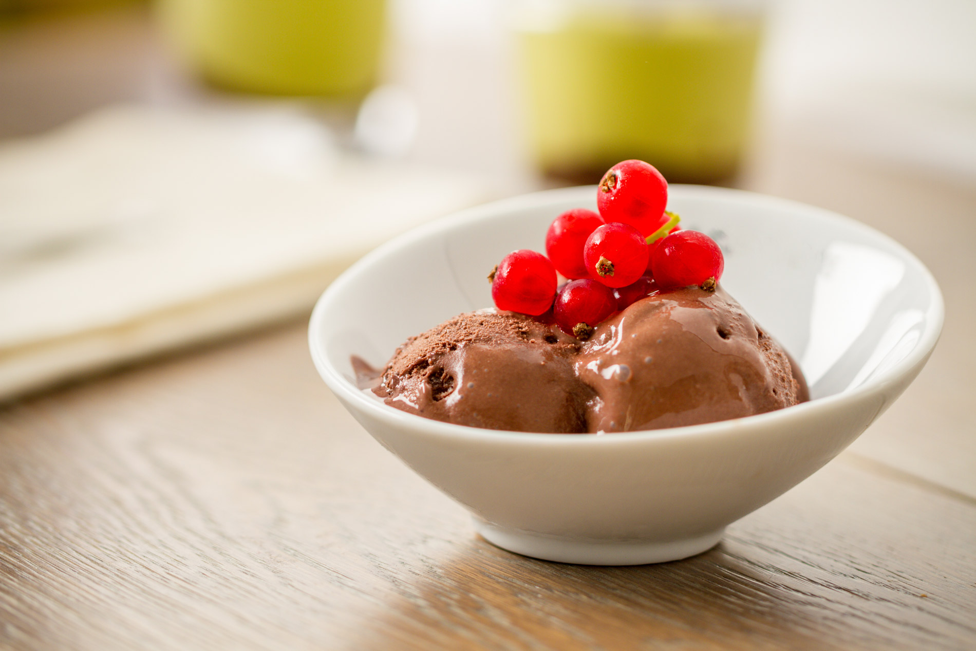 homemade chocolate ice cream with fresh berries on top