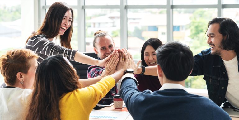 group of people high five