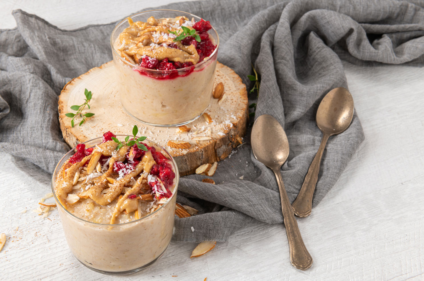 cups of oatmeals with fruits and nuts